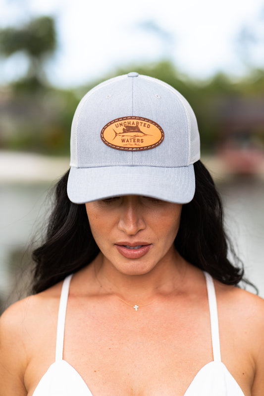 Uncharted Waters Oval Leather Patch Heather Grey Trucker Cap - Snapback